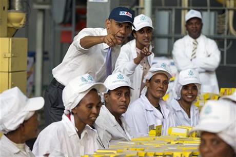 U.S. President Barack Obama talks with workers during a tour of Faffa Food, Tuesday, July 28, 2015, in Addis Ababa, Ethiopia. On the final day of his African trip, Obama is focusing on economic opportunities and African security. (AP Photo/Evan Vucci)
