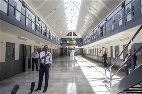 President Barack Obama speaks at the El Reno Federal Correctional Institution, in El Reno, Okla., Thursday, July 16, 2015. As part of a weeklong focus on inequities in the criminal justice system, the president will meet separately Thursday with law enforcement officials and nonviolent drug offenders who are paying their debt to society at the El Reno Federal Correctional Institution, a medium-security prison for male offenders near Oklahoma City. (AP Photo/Evan Vucci)