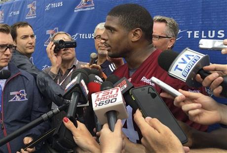 Montreal Alouettes defensive lineman Michael Sam speaks to reporters after returning to practice with the Canadian Football League team Monday, June 29, 2015, in Montreal.  (AP Photo/Jimmy Golen)