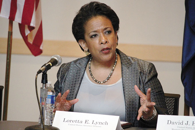 HIGH LEVEL HELP—U.S. Attorney General Loretta Lynch says she will help police and communities bridge “the rifts that divide us” at a community policing roundtable in the Hill District, Aug. 10. (Photo by J.L. Martello)