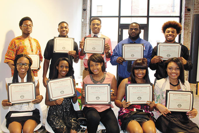 ACTIVISM IS LOVE—The graduating class, seated, from left:  Natalee Wilmer, Clara Bell, Makeda Drew, Monye Holiday and Janel Carter. Standing, from left: Kaceem Barnett, Malik Petite, Matthew Holiday, Frederick Johnson and Malik Barber. (Photos by J. L. Martello) 