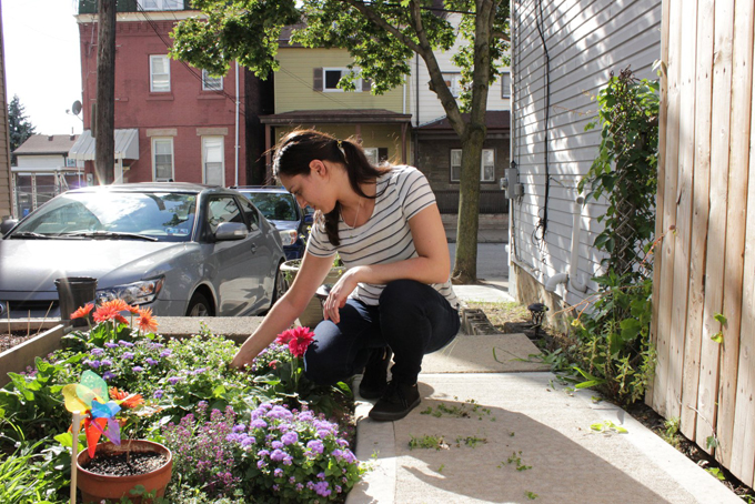 Cori Shetter, a 31-year-old server, gives what money she can to her parents who own her Lawrenceville home and pay mortgage and other expenses. “If I didn’t have my family, I’d be a lot worse off,” she said. (Photo by Molly Duerig)