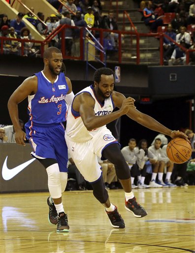 Team World's Chris Paul, left, chases Team Africa's Luc Mbah, right, during the NBA Africa Game at Ellis Park Arena in Johannesburg, South Africa, Saturday, Aug. 1, 2015.  (AP Photo/Themba Hadebe)