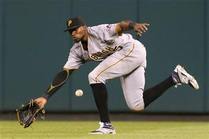 Pittsburgh Pirates right fielder Gregory Polanco is unable to field an RBI triple by St. Louis Cardinals' Yadier Molina during the sixth inning of a baseball game Wednesday, Aug. 12, 2015, in St. Louis. (Chris Lee/St. Louis Post-Dispatch via AP)