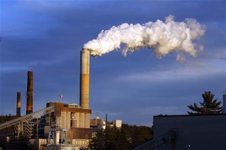  In this Jan. 20, 2015 file photo, a plume of steam billows from the coal-fired Merrimack Station in Bow, N.H. President Barack Obama on Monday, Aug. 3, 2015, will unveil the final version of his unprecedented regulations clamping down on carbon dioxide emissions from existing U.S. power plants. The Obama administration first proposed the rule last year. Opponents plan to sue immediately to stop the rule's implementation. (AP Photo/Jim Cole, File)