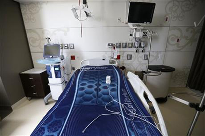 FILE - This Wednesday, June 17, 2015 photo shows a patient room that features designs similar to traditional New Orleans wrought iron architecture in the soon to open University Medical Center New Orleans, during a media tour in New Orleans. Ten years after the levees and floodwalls broke during Hurricane Katrina and flooded New Orleans, the Big Easy finally has a full-scale public hospital again, a new Charity hospital. Starting at 6 a.m. Saturday, Aug. 1 the brand new 1.6-million-square-foot University Medical Center New Orleans, built with $1.1 billion of federal rebuilding money, will open its doors to ambulances and the general public. (AP Photo/Gerald Herbert)