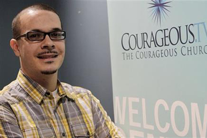 In this undated photo, Shaun King poses where he was the lead pastor of Courageous Church in Midtown Atlanta. King, a blogger who rose to prominence in the aftermath of a police shooting last summer in Ferguson, Mo., pushed back against claims by conservative bloggers that his parents were both white and that he exaggerated an assault he endured two decades ago while attending high school in Versailles, Ky. (Vino Wong/Atlanta Journal-Constitution via AP)