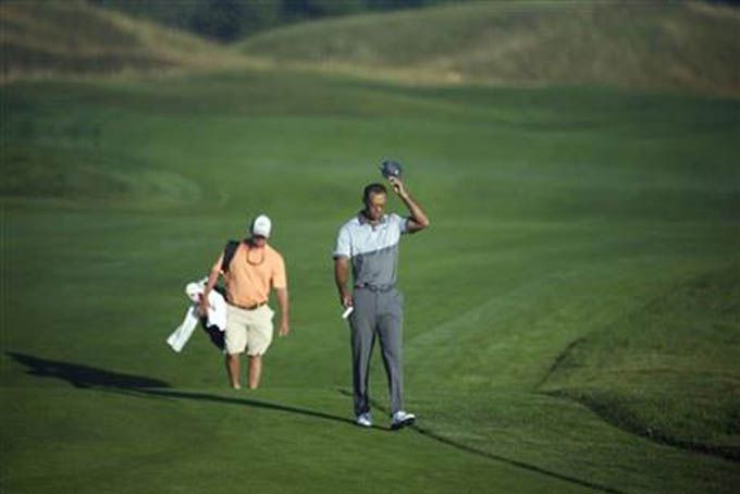 Tiger Woods walks up the first hole during a practice round for the PGA Championship golf tournament Tuesday, Aug. 11, 2015, at Whistling Straits in Haven, Wis. (AP Photo/Chris Carlson)