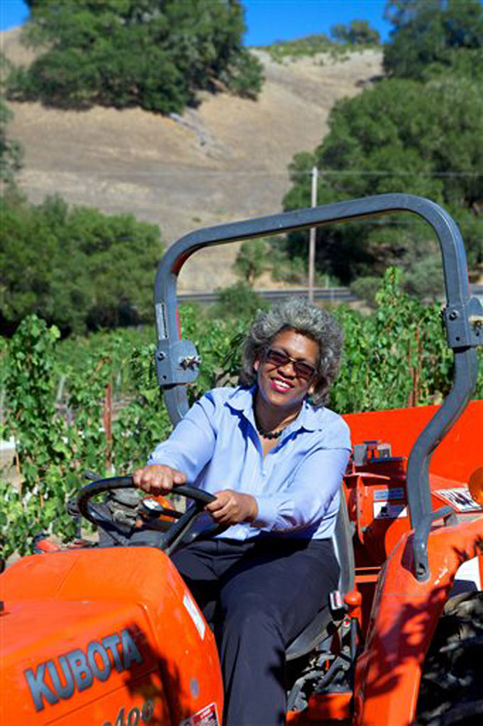 Theopolis Vineyards owner Theodora Lee is shown at her vineyard in Yorkville, Calif., in this September, 2013, photo.  Increasingly, more African Americans and other minorities are making and drinking wine, a movement which many say has made the industry less elitist and attracted more diverse customers, but comes with its own challenges. (AP Photo/Leslie Stovall)