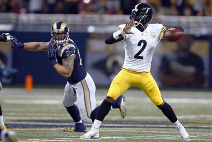 Pittsburgh Steelers quarterback Michael Vick, right, throws under pressure from St. Louis Rams defensive end Chris Long, left, during the fourth quarter of an NFL football game Sunday, Sept. 27, 2015, in St. Louis. (AP Photo/Billy Hurst)