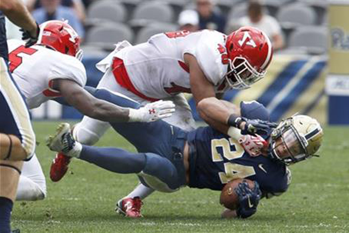 Youngstown State linebacker Jaylin Kelly (40) tackles Pittsburgh running back James Conner (24) in the second quarter of an NCAA college football game, Saturday, Sept. 5, 2015, in Pittsburgh. (AP Photo/Keith Srakocic)