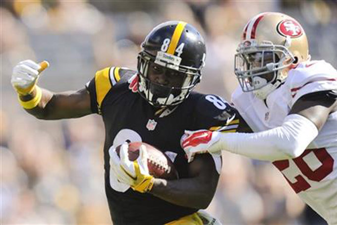 Pittsburgh Steelers wide receiver Antonio Brown (84) twists away from San Francisco 49ers cornerback Tramaine Brock (26) to go for a big gain after making a catch in the second quarter of an NFL football game, Sunday, Sept. 20, 2015, in Pittsburgh. (AP Photo/Don Wright)