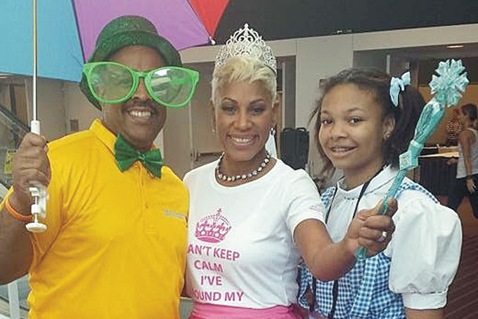 HIGHMARK HAVING FUN—Employees Alex Matthews and Atiya Abdelmalik with her daughter.