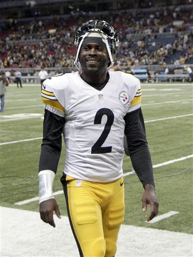 Pittsburgh Steelers quarterback Michael Vick smiles as he walks off the field following an NFL football game against the St. Louis Rams, Sunday, Sept. 27, 2015, in St. Louis. Vick came into the game after Steelers starting quarterback Ben Roethlisberger was injured. (AP Photo/Tom Gannam)