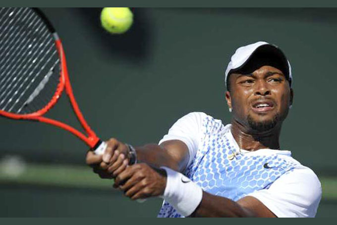 This March 12, 2011, file photo shows Donald Young making a return against Andy Murray during their match at the BNP Paribas Open tennis tournament, in Indian Wells, Calif. Offended by Young's expletive-laden rip on the USTA via Twitter, Patrick McEnroe responded Monday April 25, 2011, with a pointed comeback of his own, saying the 21-year-old would need to apologize before the USTA did anything more to support him. (AP Photo/Mark J. Terrill, File)