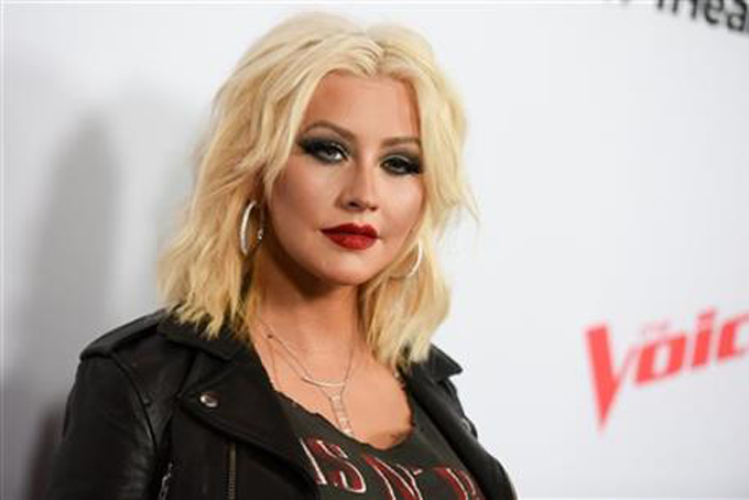 FILE - In this April 23, 2015 file photo, Christina Aguilera arrives at Season 8 of "The Voice" Red Carpet Event in West Hollywood, Calif. Aguilera was on a humanitarian trip in Ecuador last week filming a new PSA for Yum! Brands World Hunger Relief effort that raises awareness, volunteerism and funds for WFP and other hunger relief agencies. (Photo by Richard Shotwell/Invision/AP, File)