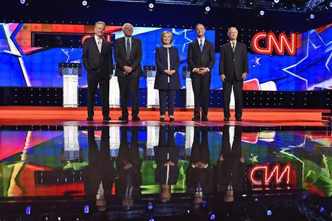 In this Oct. 13, 2015, photo, Democratic presidential candidates from left, former Virginia Sen. Jim Webb, Sen. Bernie Sanders, I-Vt., Hillary Rodham Clinton, former Maryland Gov. Martin O'Malley, and former Rhode Island Gov. Lincoln Chafee take the stage before the CNN Democratic presidential debate in Las Vegas. Democratic presidential candidates gave a meaningful public nod to the Black Lives Matter movement in their first televised debate. The candidates invoked its slogan and raised the core concerns stemming from police killings of African-Americans. Protesters have articulated those concerns in disrupting some of the candidates’ campaign events. (AP Photo/David Becker)