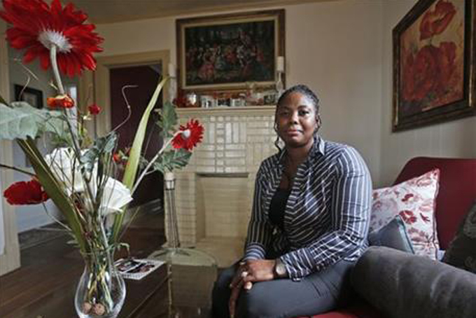 Gwendolyn Smalls poses in her home in Richmond, Va., Thursday, Nov. 12, 2015. Smalls' brother, Linwood R. Lambert Jr., died in police custody in May of 2013 after being repeatedly stunned by South Boston police. Lambert's family filed a $25 million lawsuit in April, accusing the officers of unlawfully arresting him and using "excessive, unreasonable and deadly force," but no charges have been filed. (AP Photo/Steve Helber) 