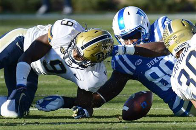 Pittsburgh's Jordan Whitehead (9) battle Duke's David Reeves (80) for a fumble during an NCAA college football game Saturday, Nov. 14, 2015, in Durham, N.C. (Bernard Thomas/The Herald-Sun via AP) 