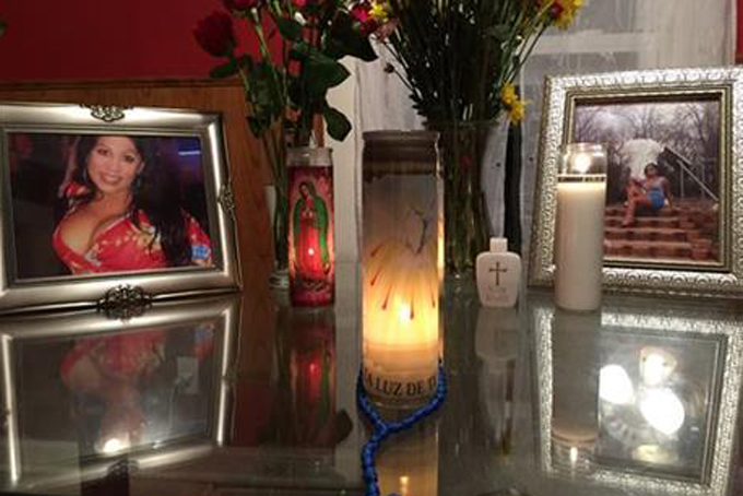 This Monday, Aug. 17, 2015 photo provided by Randall Jenson, lead advocate of the Kansas City Anti-Violence Project, shows an altar made by the friends of Tamara Dominguez during a memorial service for her at her home. Dominguez was run over multiple times and left to die on a Kansas City street. For a few transgender Americans, this has been a year of glamour and fame. For many others, 2015 has been fraught with danger, violence and mourning. (Randall Jenson/Kansas City Anti-Violence Project via AP)