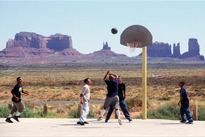 In this Aug. 27, 1997 file photo, students from Monument Valley High School on the Navajo Reservation in southeast Utah, play basketball during a lunch break during the first day of classes. The U.S. Census Bureau is testing new questions on tribal enrollment for the 2020 count in an effort to get a more accurate tally of American Indians. Census director John Thompson told The Associated Press on Tuesday, Nov. 17, 2015, that the agency is aiming to avoid a 5 percent undercount of the population seen in 2010. (Marc Lester/The Daily Herald via AP, File) 