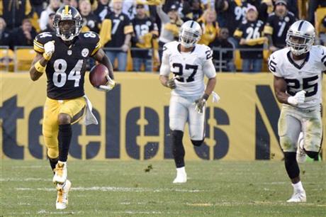 Pittsburgh Steelers wide receiver Antonio Brown (84) runs past Oakland Raiders strong safety Taylor Mays (27) and cornerback D.J. Hayden (25) after making a catch to help set up the Steelers game-winning field goal in the second half of an NFL football game Sunday, Nov. 8, 2015, in Pittsburgh. (AP Photo/Don Wright)