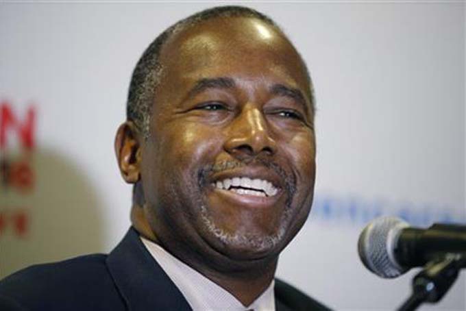 In this Nov. 23, 2015 photo, Republican presidential candidate, Dr. Ben Carson holds a news conference after a rally in Pahrump, Nev. For many African Americans _ the vast majority of them Democrats _ there are two Carsons: one a genius doctor, and an inspirational speaker and writer who talks of limitless horizons, and the other a presidential candidate whose conservative politics have rocketed him to the top of the Republican primary polls. (AP Photo/John Locher)