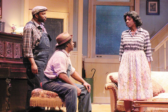 CAST—From left: Monteze Freeland, standing, Wali Jamal, seated, and Karla C. Payne. 
