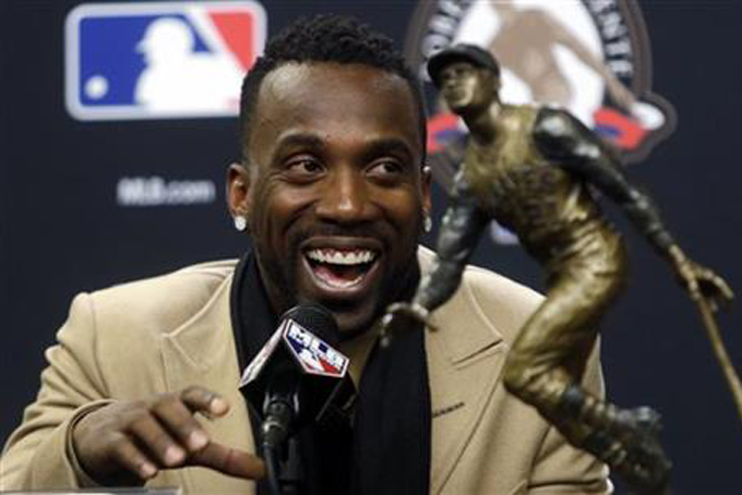 Pittsburgh Pirates Andrew McCutchen smiles at a news conference where he was announced the Roberto Clemente Award winner for 2015 before Game 3 of the Major League Baseball World Series between the New York Mets and the Kansas City Royals Friday, Oct. 30, 2015, in New York. (AP Photo/Frank Franklin II)