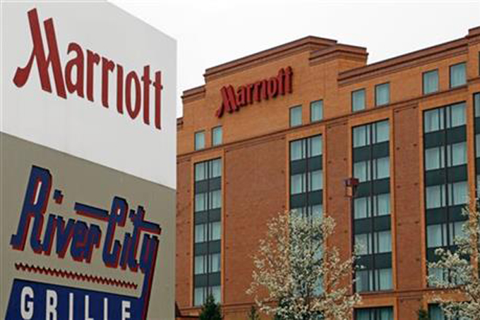 This Monday, April, 28, 2014, file photo, shows a Marriott hotel in Cranberry Township, Pa. Marriott International announced Monday, Nov. 16, 2015, it is buying rival hotel chain Starwood for $12.2 billion in a deal that will secure its position as the world's largest hotelier. (AP Photo/Gene J. Puskar, File)