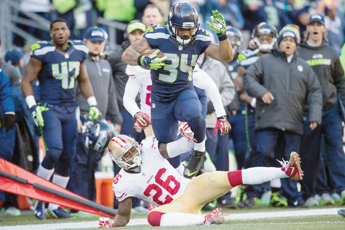 NOT JUST ANOTHER ROOKIE—Seattle Seahawks Thomas Rawls (34) picked up 209 yards rushing subbing for Tayshaun Lynch. (AP Photo)  
