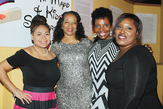 SCHOLARSHIP RECIPIENTS—Madison Zellers, left, and Shanique Waymer, right, with Constance Anderson Collier and Tallulah Anderson, second from right. 