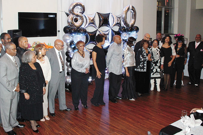 80th BIRTHDAY PARTY—Margaret Smith Washington was chauffeured from her home to her exclusive 80th birthday celebration, where she was escorted in by two gentlemen who were on the planning committee.  Friends saluted her with surprise tributes, music, poetry, dancing and well deserved accolades. Her friends and family were present to honor her in a classy and personally manner at the Encore Event Design in Pittsburgh. She is a woman who has touched many through her professionalism, Christianity, workforce experience, church and neighborhood. People from all walks of her life were present to honor her. Pictured above, Margaret Smith Washington, holding microphone, gives a heartfelt thanks for the sign of love and support. (Photos by J.L. Martello) 