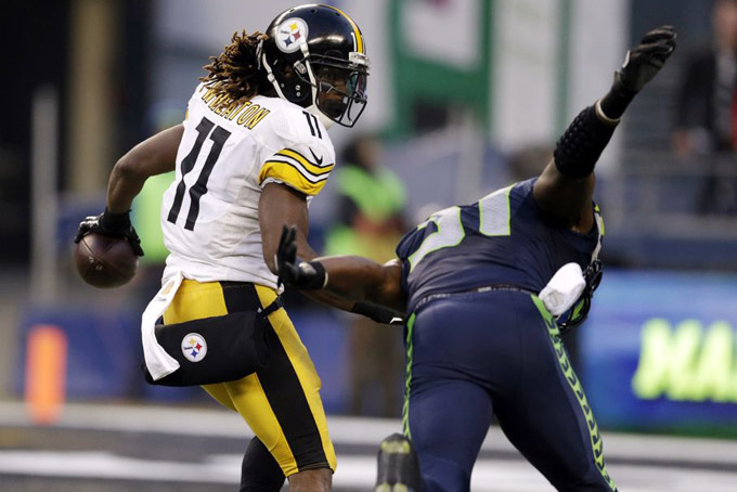 Pittsburgh Steelers' Markus Wheaton (11) looks back at Seattle Seahawks' Kam Chancellor as Wheaton runs in for a touchdown in the second half of an NFL football game, Sunday, Nov. 29, 2015, in Seattle. (AP Photo/John Froschauer)