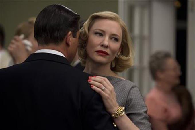 This photo provided by The Weinstein Company shows, Kyle Chandler, left, as Harge Aird, and Cate Blanchett as Carol Aird in a scene from the film, "Carol." (Wilson Webb/The Weinstein Company via AP)