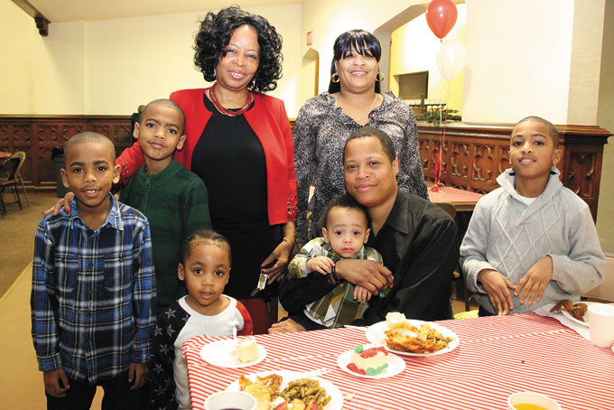 THANKFUL—The family of slain Deona Barnett is thankful for Tree of Hope's act of kindness during the holiday season. Pictured, in no order, is Adrienne Young, with Barnett's family—Radia Richardson, James Powell, Jamil Hardy, Julian Hardy, Jamal Hardy, Kyair Richardson, and Gerald Harris. 