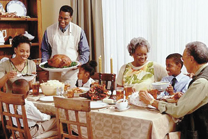 THANKSGIVING DINNER—A family sharing Thanksgiving dinner. There are thousands of people who would be thankful to have a family to share a Thanksgiving meal with. (Stock image)