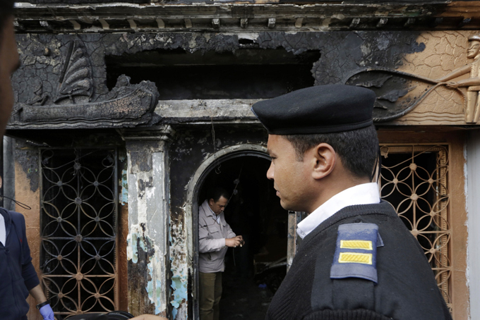  An Egyptian policeman stands in front a nightclub which was attacked in Cairo, Egypt, Friday, Dec. 4, 2015.  (Amr Nabil/AP Photo) 