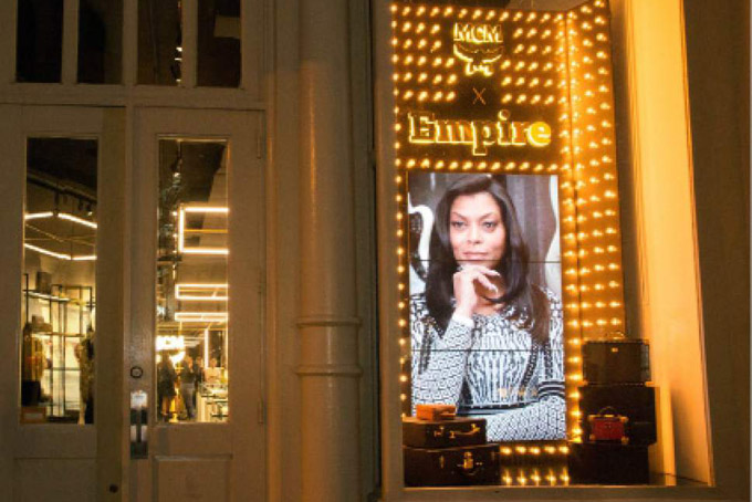 In this Sept. 15, 2015 photo provided by MCM Worldwide, a collection of merchandise inspired by the looks and styles of the Fox television show, "Empire," are displayed in MCMs SoHo store in New York. Empire is at the center of an aggressive merchandising lifestyle campaign that is capitalizing on the shows popularity. (Cheol Park/MCM Worldwide via AP)