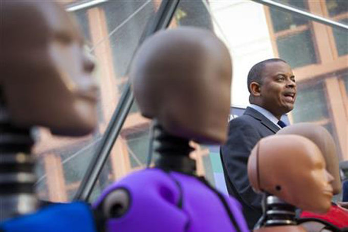  Transportation Secretary Anthony Foxx, with new crash test dummies called 'THOR', speaks during the announcement for plans to update its safety rating system for new cars to include whether the car has technology to avoid crashes, in addition to how well it protects occupants in accidents in Washington, Tuesday, Dec. 8, 2015. (AP Photo/Pablo Martinez Monsivais)