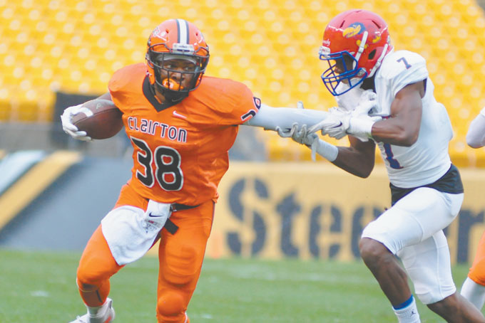 LAMONT WADE (38) Clairton, stiff arms Jeannette’s  Robert Kennedy as he picks up yards, Wade rushed for 101 yards and caught 2 touchdown passes in the Bears win 