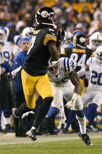 Pittsburgh Steelers wide receiver Martavis Bryant (10) catches a pass for a touchdown from quarterback Ben Roethlisberger with Indianapolis Colts cornerback Darius Butler (20) defending during the second half of an NFL football game, Sunday, Dec. 6, 2015, in Pittsburgh. (AP Photo/Don Wright)