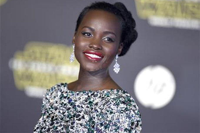 Lupita Nyong'o arrives at the world premiere of "Star Wars: The Force Awakens" at the TCL Chinese Theatre on Monday, Dec. 14, 2015, in Los Angeles. Nyong'o plays the role of Maz Kanata. (Photo by Jordan Strauss/Invision/AP)