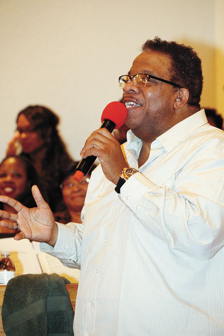 PATRICK POLK leading the choir.