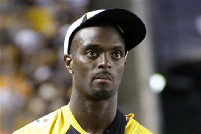 FILE - In this Saturday, Aug. 10, 2013, file photo, Pittsburgh Steelers wide receiver Plaxico Burress (80) stands on the sidelines during an NFL preseason football game against the New York Giants in Pittsburgh. Former NFL star Plaxico Burress pleaded guilty Monday, Dec. 7, 2015, to New Jersey tax evasion charges after reaching a plea deal that could potentially spare him any jail time. Burress, 38, of Totowa, declined to comment on the plea he entered in state Superior Court, telling reporters to "have a good day" as he left the courtroom. (AP Photo/Gene J. Puskar, File)
