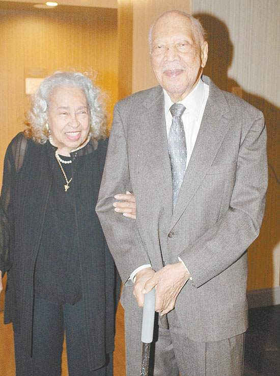 PROUD COUPLE—Helena G. Hughes and husband, John Hughes, as they walked into the hotel. (Photos by J.L. Martello)
