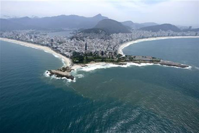 This Oct. 9, 2015 file photo shows the beaches of Ipanema, left, and Copacabana, right, in Rio de Janeiro. The 2016 Olympic Games will be held in Rio de Janeiro. (AP Photo/David J. Phillip, File)