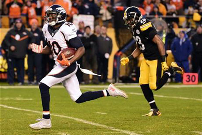 Denver Broncos wide receiver Emmanuel Sanders (10) runs past Pittsburgh Steelers free safety Mike Mitchell (23) for a touchdown during the first half of an NFL football game in Pittsburgh, Sunday, Dec. 20, 2015. (AP Photo/Fred Vuich)