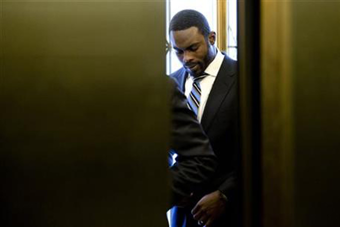 Elevator doors close after Pittsburgh Steelers quarterback Michael Vick arrives at the state Capitol, Tuesday, Dec. 8, 2015, in Harrisburg, Pa. Vick is lobbing Pennsylvania statehouse legislators on a bill that would help protect pets left in hot cars. Vick was a star quarterback for the NFL's Atlanta Falcons when he pleaded guilty in 2007 to being part of a dogfighting ring and ended up serving 21 months in prison. (AP Photo/Matt Rourke)