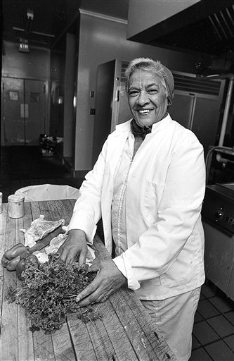 In this April 15, 1986 file photo, Leah Chase, is seen in the kitchen of her restaurant "Dooky Chase's." New Orleans restaurateur Leah Chase broke the citys segregation laws by serving white and black customers, including civil rights leaders like Thurgood Marshall. She strove to provide an upscale, white-tablecloth dining experience at a time when none existed for blacks in the city. And after Hurricane Katrina she lived in a FEMA trailer for months as her beloved Dooky Chases Restaurant was being rebuilt, and she still goes to work daily. She said she has few regrets. Well, maybe one. Maybe I should have worked harder. I dont know. But I did the best I could do. (AP Photo/Burt Steel, File)